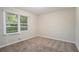 Spacious bedroom with neutral carpeting and large windows at 2519 Brentwood Rd, Decatur, GA 30032