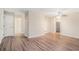 Open living area with hardwood floors, neutral walls, and access to other rooms at 2519 Brentwood Rd, Decatur, GA 30032