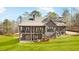 Gray house with a large deck and attached garage at 1401 Whooping Creek Rd, Carrollton, GA 30116