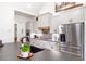 Bright kitchen features white cabinets, stainless steel appliances, and a large island at 1401 Whooping Creek Rd, Carrollton, GA 30116