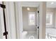 Well-lit bathroom with toilet, shower, and single vanity at 542 Little Vine Church Rd, Villa Rica, GA 30180