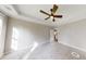 Bright bedroom with carpet, ceiling fan and large windows at 542 Little Vine Church Rd, Villa Rica, GA 30180