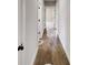Hallway with hardwood floors and neutral walls at 542 Little Vine Church Rd, Villa Rica, GA 30180