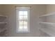 Walk in pantry with wire shelving and a window at 542 Little Vine Church Rd, Villa Rica, GA 30180