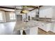 Modern kitchen features granite island, white cabinetry, and stainless steel appliances at 542 Little Vine Church Rd, Villa Rica, GA 30180