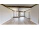 Bright dining room with hardwood floors and exposed beams at 542 Little Vine Church Rd, Villa Rica, GA 30180