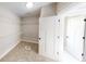 Large walk-in closet with wire shelving and carpeted floor at 542 Little Vine Church Rd, Villa Rica, GA 30180