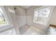 Large walk-in shower with tile surround and built-in seat at 542 Little Vine Church Rd, Villa Rica, GA 30180