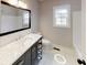 Bathroom with single vanity, toilet and bathtub at 542 Little Vine Church Rd, Villa Rica, GA 30180