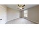 Bright bedroom with carpeted floor and ceiling fan at 542 Little Vine Church Rd, Villa Rica, GA 30180
