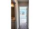 Hallway with carpet, leading to a bright room and bathroom at 967 Sutherland Lane(Lot 128), Lawrenceville, GA 30043