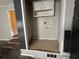 Small laundry room with washer and dryer hookups and upper cabinets at 6862 Old Beulah Rd, Lithia Springs, GA 30122