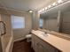 Clean bathroom, featuring a vanity with storage and a shower/tub combo at 6862 Old Beulah Rd, Lithia Springs, GA 30122