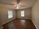 Spacious bedroom with wood-look floors and two windows at 6862 Old Beulah Rd, Lithia Springs, GA 30122