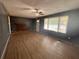 Living room featuring hardwood floors, a fireplace and large windows at 6862 Old Beulah Rd, Lithia Springs, GA 30122