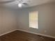 Spacious bedroom with wood-look floors and a ceiling fan at 6862 Old Beulah Rd, Lithia Springs, GA 30122