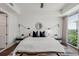 Bright bedroom with a king-size bed and city views at 1820 Peachtree St # 1607, Atlanta, GA 30309