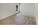 Spacious bedroom with neutral carpeting and a window at 4549 Gapstow Bridge Ln, Acworth, GA 30101