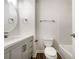 Updated bathroom with a modern vanity, a new toilet, and bathtub at 2140 Fern Valley Sw Dr, Atlanta, GA 30331