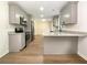 Modern kitchen with gray cabinets, granite countertops, and stainless steel appliances at 2140 Fern Valley Sw Dr, Atlanta, GA 30331