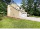 Two-car garage with driveway and side yard at 2140 Fern Valley Sw Dr, Atlanta, GA 30331