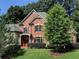 Brick house with a large front yard and landscaping at 319 Summer Garden Dr, Marietta, GA 30064