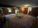 Spacious basement with carpeted floor and wood paneling at 612 Mincey Woods Ct, Stone Mountain, GA 30087