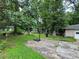 Large backyard with basketball court and mature trees at 612 Mincey Woods Ct, Stone Mountain, GA 30087