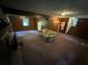 Spacious basement with carpeted floor and wood paneling at 612 Mincey Woods Ct, Stone Mountain, GA 30087