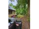 Large backyard with mature trees and a partially visible structure at 1974 Lois Nw Pl, Atlanta, GA 30318