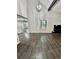 Spacious dining room with hardwood floors and a chandelier at 5432 Post Road Pass, Stone Mountain, GA 30088