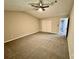 Spacious bedroom with double doors and carpet at 5432 Post Road Pass, Stone Mountain, GA 30088