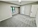 Spacious bedroom with grey carpet and built-in shelving at 5432 Post Road Pass, Stone Mountain, GA 30088