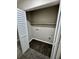 Laundry closet with built-in shelving and hookups at 5432 Post Road Pass, Stone Mountain, GA 30088