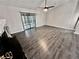 Living room with dark floors and sliding glass doors at 5432 Post Road Pass, Stone Mountain, GA 30088