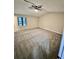 Large bedroom with ceiling fan and grey carpet at 5432 Post Road Pass, Stone Mountain, GA 30088