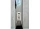 Long hallway with grey carpet and skylight at 5432 Post Road Pass, Stone Mountain, GA 30088