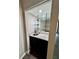 Wet bar with granite countertop, sink, and glass shelving at 5432 Post Road Pass, Stone Mountain, GA 30088
