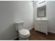 Clean bathroom with vanity, toilet, and wood-look floor at 42 Belmonte Sw Cir, Atlanta, GA 30311