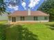 House exterior with large backyard and sliding glass doors at 5233 Walnut Ct, Lithonia, GA 30038