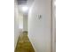 Long hallway with light walls and wood-look flooring at 5233 Walnut Ct, Lithonia, GA 30038