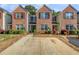 Brick front exterior of townhome with attached garage at 3583 Rock Ridge Dr, Rex, GA 30273
