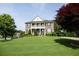 Two-story house with a large front yard and mature trees at 249 Chadwyck Ln, Canton, GA 30115