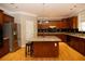 Spacious kitchen with island, granite countertops, and hardwood floors at 249 Chadwyck Ln, Canton, GA 30115