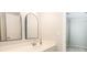 Modern bathroom with double vanity, arched mirrors, and an additional closet at 249 Chadwyck Ln, Canton, GA 30115