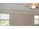 Spacious bedroom with neutral walls and two windows, and a ceiling fan at 249 Chadwyck Ln, Canton, GA 30115