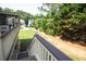 Deck stairs leading down to a grassy backyard at 249 Chadwyck Ln, Canton, GA 30115