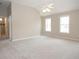 Spacious main bedroom with high ceilings and carpet at 249 Chadwyck Ln, Canton, GA 30115