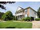 Brick and siding two story house with a side view of garage at 249 Chadwyck Ln, Canton, GA 30115