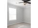 Bright bedroom with neutral walls, carpet, and ceiling fan at 249 Chadwyck Ln, Canton, GA 30115